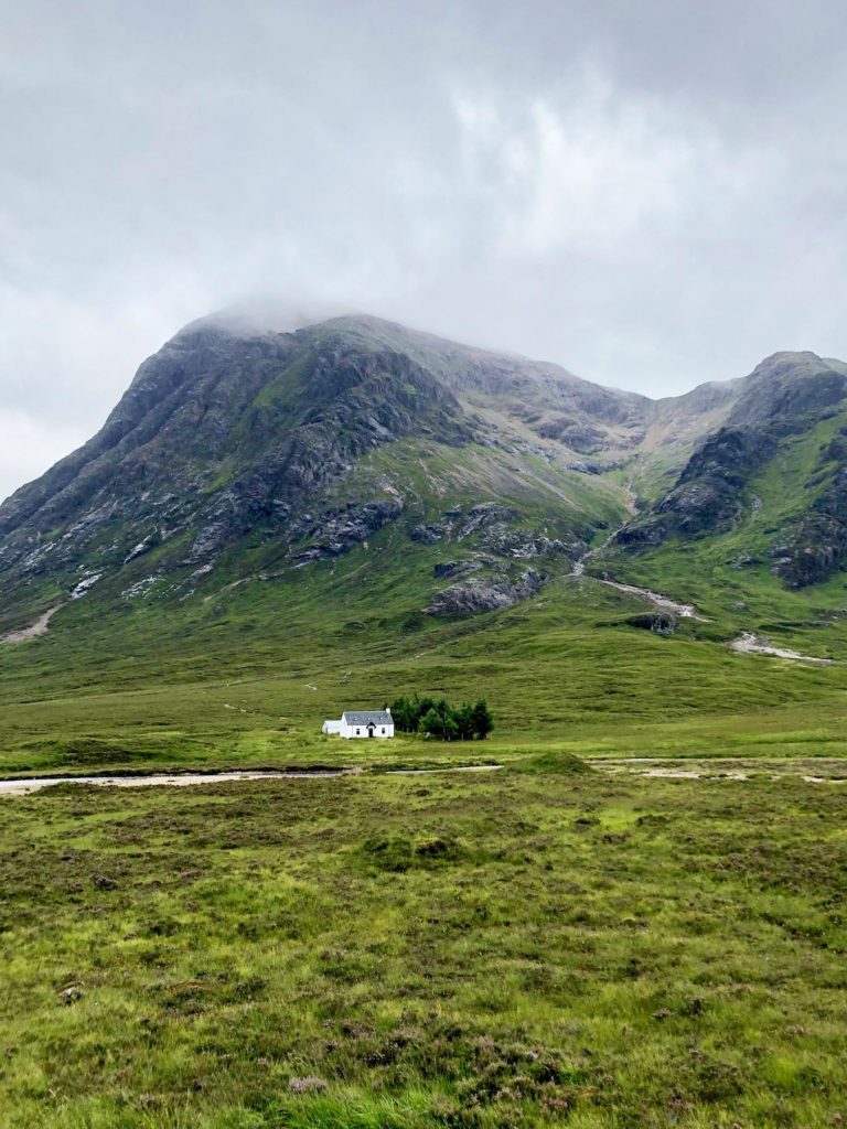 A-white-house-in-Glen-Coe-in-the-Scottish-Highlands-Scotland-Itinerary